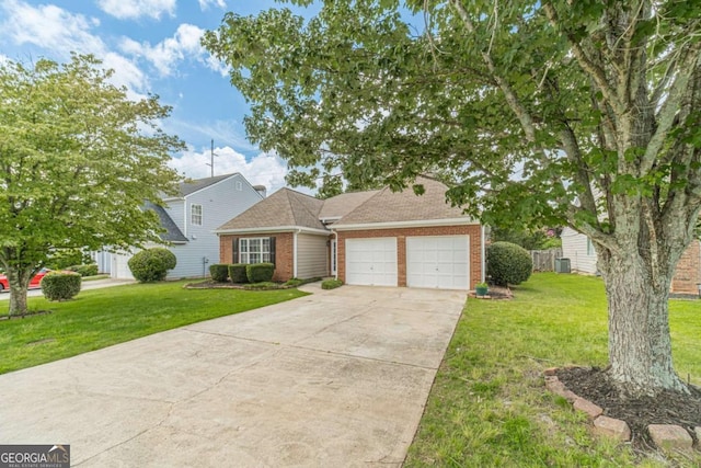 2895 Dominion Walk Ln, Snellville, GA 30078 - traditional home with brick siding, a garage, driveway, and a front yard