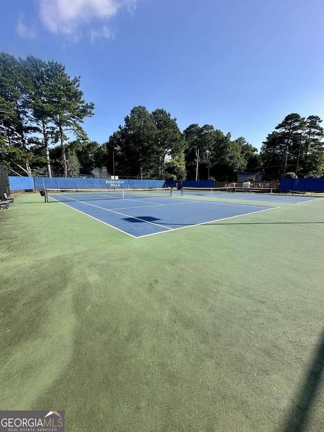 2895 Dominion Walk Ln, Snellville, GA 30078 - view of tennis court featuring view of wooded area