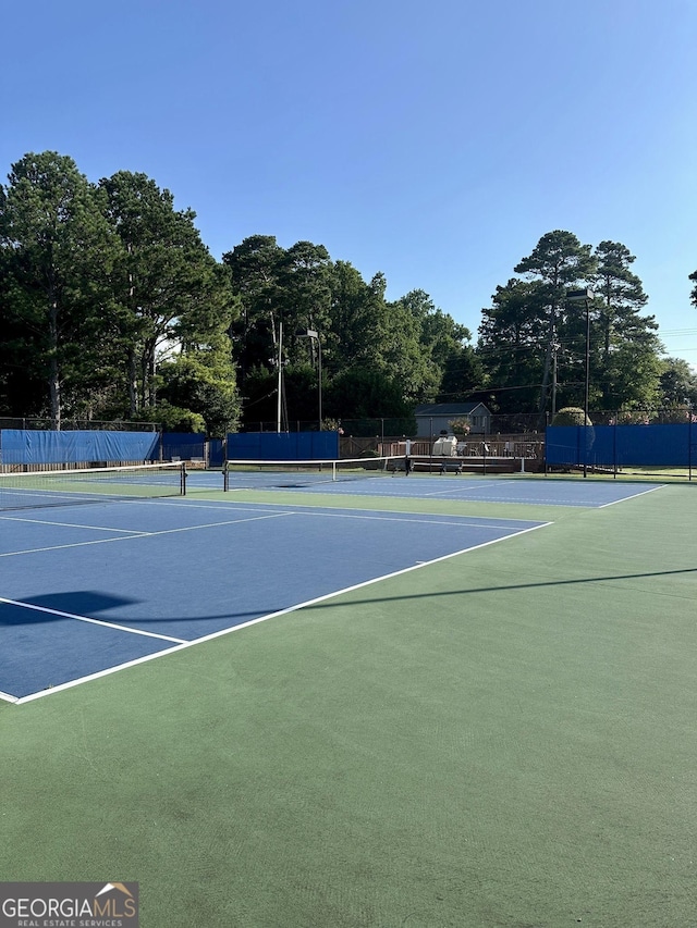 2895 Dominion Walk Ln, Snellville, GA 30078 - view of tennis court featuring community basketball court and view of wooded area
