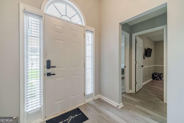2895 Dominion Walk Ln, Snellville, GA 30078 - entrance foyer with light wood-type flooring and healthy amount of natural light