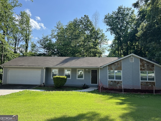 1701 Charmeth Rd, Lithonia, GA 30058 - view of front facade with an attached garage, a front yard, asphalt driveway, and stone siding