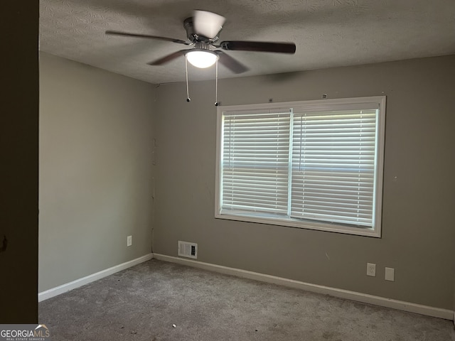 1701 Charmeth Rd, Lithonia, GA 30058 - carpeted spare room with a ceiling fan and a textured ceiling