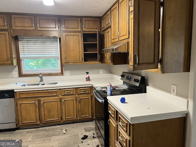 1701 Charmeth Rd, Lithonia, GA 30058 - kitchen with black electric range oven, stainless steel dishwasher, light countertops, under cabinet range hood, and light wood-style floors