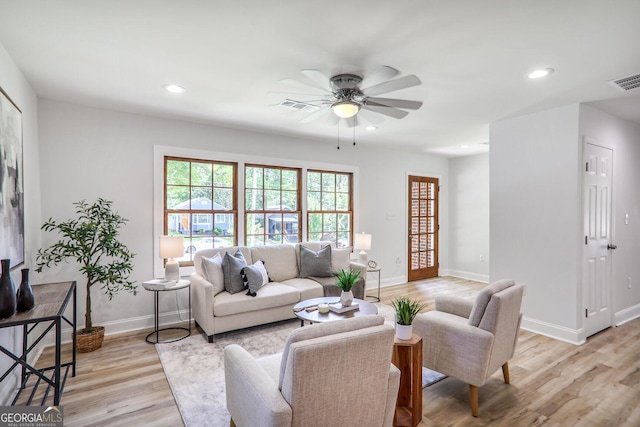 911 Oakland Dr SW, Atlanta, GA 30310 - living room with light wood finished floors, ceiling fan, and recessed lighting