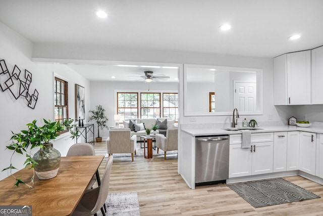 911 Oakland Dr SW, Atlanta, GA 30310 - kitchen featuring stainless steel dishwasher, light countertops, light wood-type flooring, ceiling fan, and recessed lighting