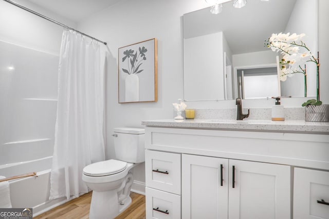 911 Oakland Dr SW, Atlanta, GA 30310 - full bathroom featuring vanity, wood finished floors, and shower / bath combo