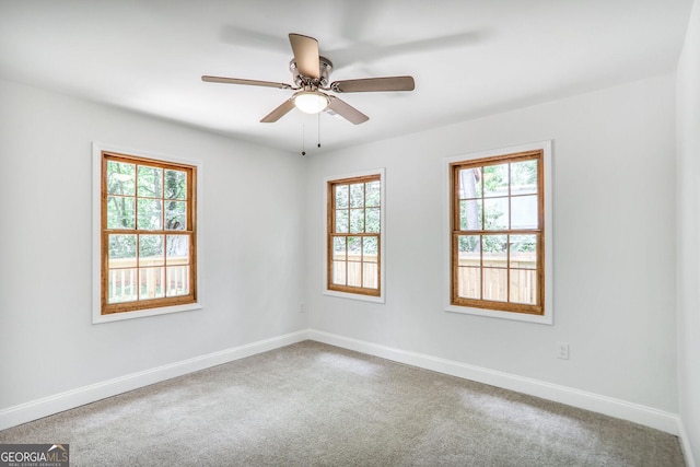911 Oakland Dr SW, Atlanta, GA 30310 - unfurnished room with carpet floors and a ceiling fan