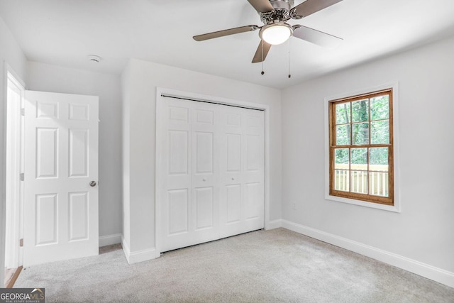911 Oakland Dr SW, Atlanta, GA 30310 - unfurnished bedroom with carpet, a closet, and ceiling fan