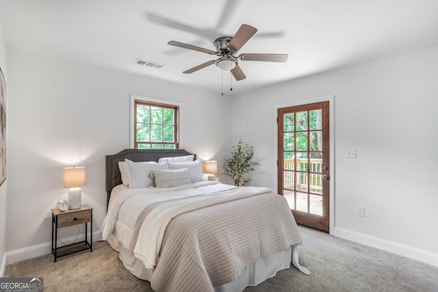 911 Oakland Dr SW, Atlanta, GA 30310 - bedroom with light colored carpet, access to exterior, and ceiling fan