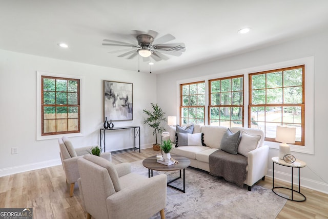911 Oakland Dr SW, Atlanta, GA 30310 - living room featuring healthy amount of natural light, a ceiling fan, light wood finished floors, and recessed lighting