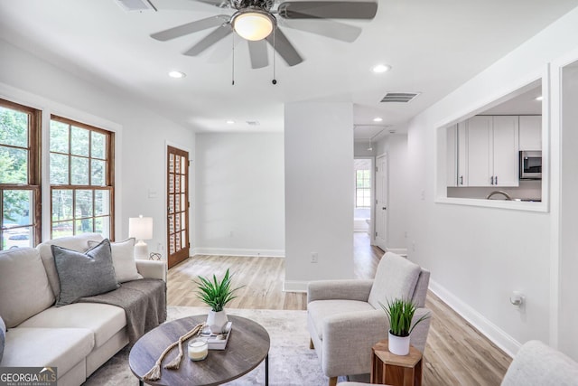 911 Oakland Dr SW, Atlanta, GA 30310 - living area with light wood-style flooring, ceiling fan, and recessed lighting