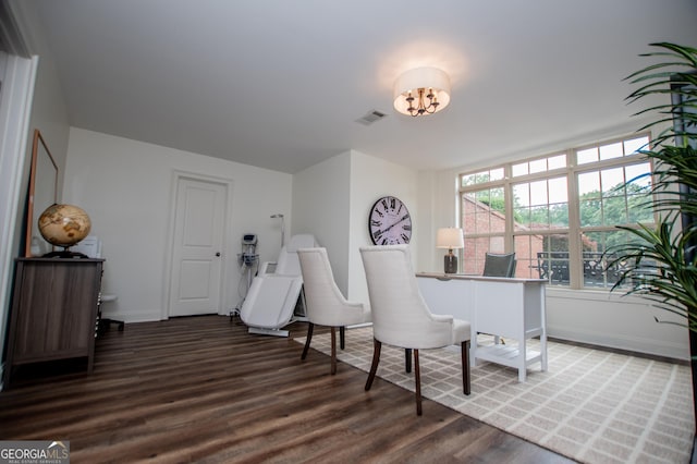 713 Birkdale Blvd, Carrollton, GA 30116 - sitting room featuring wood finished floors and a chandelier