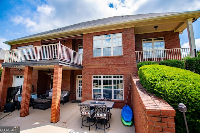 713 Birkdale Blvd, Carrollton, GA 30116 - rear view of property with a balcony, brick siding, outdoor lounge area, and a patio area