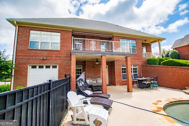 713 Birkdale Blvd, Carrollton, GA 30116 - rear view of property with a balcony, an attached garage, brick siding, and an outdoor hangout area