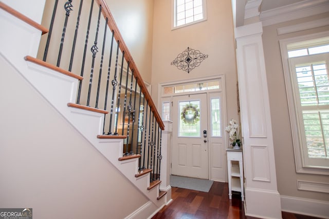 713 Birkdale Blvd, Carrollton, GA 30116 - foyer featuring dark wood finished floors, stairs, a towering ceiling, and plenty of natural light