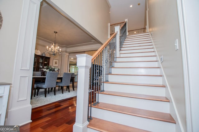 713 Birkdale Blvd, Carrollton, GA 30116 - stairs featuring a chandelier, wood finished floors, ornamental molding, and ornate columns