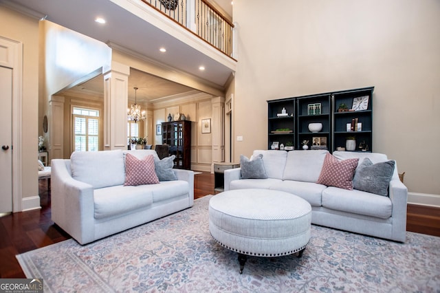 713 Birkdale Blvd, Carrollton, GA 30116 - living area featuring wood finished floors, a chandelier, ornamental molding, decorative columns, and recessed lighting