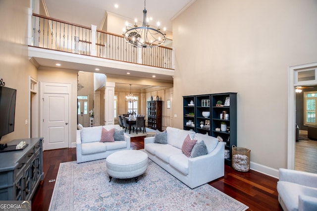 713 Birkdale Blvd, Carrollton, GA 30116 - living area with a chandelier, a high ceiling, ornamental molding, dark wood finished floors, and healthy amount of natural light