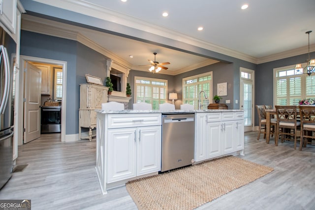 713 Birkdale Blvd, Carrollton, GA 30116 - kitchen with stainless steel appliances, white cabinetry, light wood-type flooring, light stone countertops, and ornamental molding