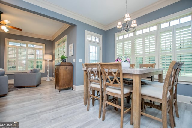 713 Birkdale Blvd, Carrollton, GA 30116 - dining space featuring healthy amount of natural light, a chandelier, light wood-type flooring, crown molding, and ceiling fan