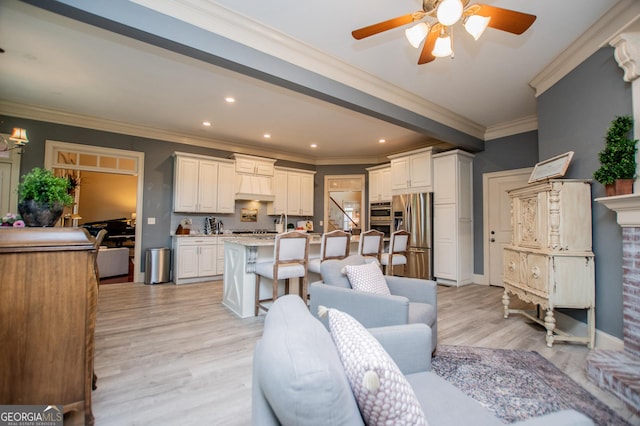 713 Birkdale Blvd, Carrollton, GA 30116 - living room featuring ceiling fan, crown molding, light wood-style flooring, and recessed lighting