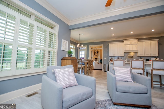 713 Birkdale Blvd, Carrollton, GA 30116 - living area featuring a chandelier, ornamental molding, ceiling fan, recessed lighting, and light wood-style floors
