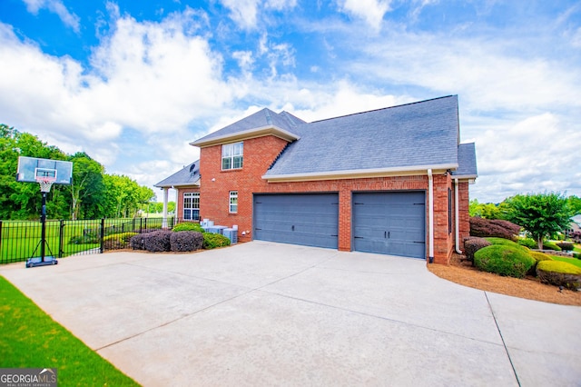 713 Birkdale Blvd, Carrollton, GA 30116 - view of home's exterior featuring concrete driveway, brick siding, a garage, and roof with shingles