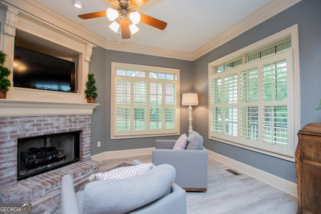 713 Birkdale Blvd, Carrollton, GA 30116 - living room with ornamental molding, wood finished floors, a ceiling fan, and a fireplace