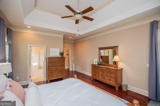 713 Birkdale Blvd, Carrollton, GA 30116 - bedroom with a raised ceiling, dark wood-type flooring, crown molding, ensuite bathroom, and recessed lighting