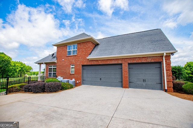 713 Birkdale Blvd, Carrollton, GA 30116 - view of front facade with brick siding, concrete driveway, a shingled roof, and an attached garage