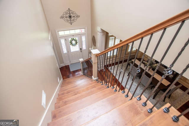 713 Birkdale Blvd, Carrollton, GA 30116 - staircase with wood finished floors and a high ceiling