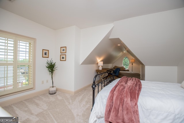 713 Birkdale Blvd, Carrollton, GA 30116 - carpeted bedroom with vaulted ceiling and baseboards