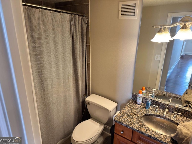2479 Peachtree Rd NE Unit 1714, Atlanta, GA 30305 - full bathroom with vanity, wood finished floors, and curtained shower