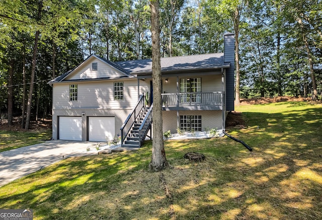 90 Lake Avalon Ct, Dallas, GA 30157 - view of front of home with a chimney, driveway, a front lawn, stairway, and a garage