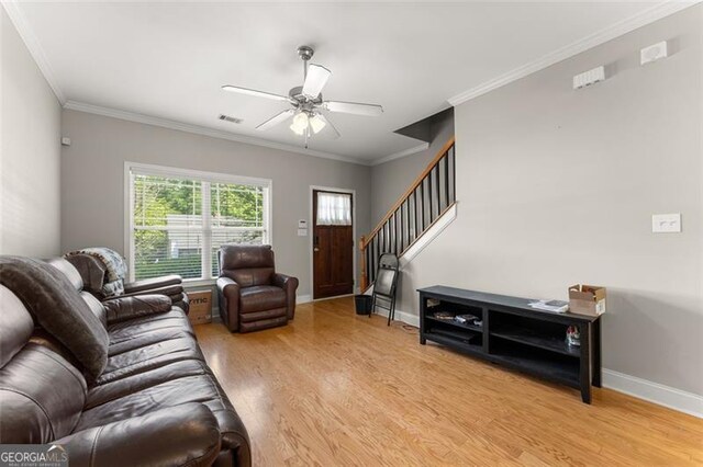 373 Whitehall, Athens, GA 30605 - living area with light wood-type flooring, a ceiling fan, stairway, and crown molding