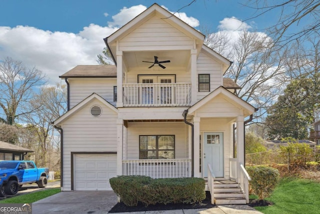 260 Westview Pl SW, Atlanta, GA 30314 - view of front facade with a balcony, covered porch, ceiling fan, an attached garage, and driveway