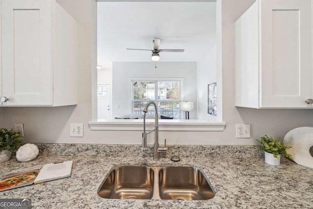 260 Westview Pl SW, Atlanta, GA 30314 - kitchen featuring white cabinetry, light stone counters, and ceiling fan