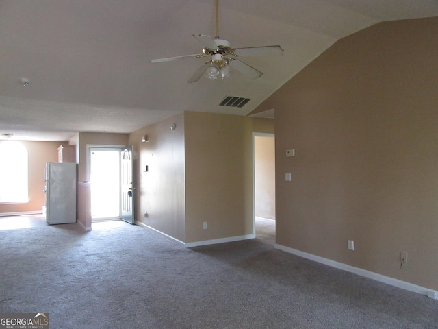5799 Eagles Feather Ln, Riverdale, GA 30274 - empty room with carpet, vaulted ceiling, and a ceiling fan