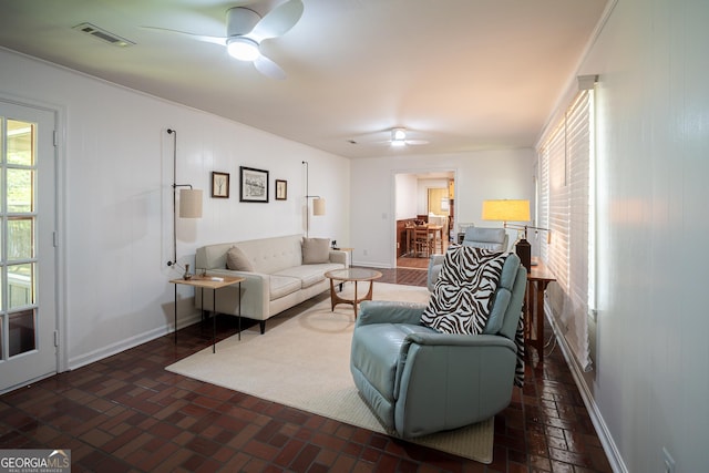 67 Dixie Park Rd NW, Rome, GA 30165 - living area featuring ceiling fan and brick floors