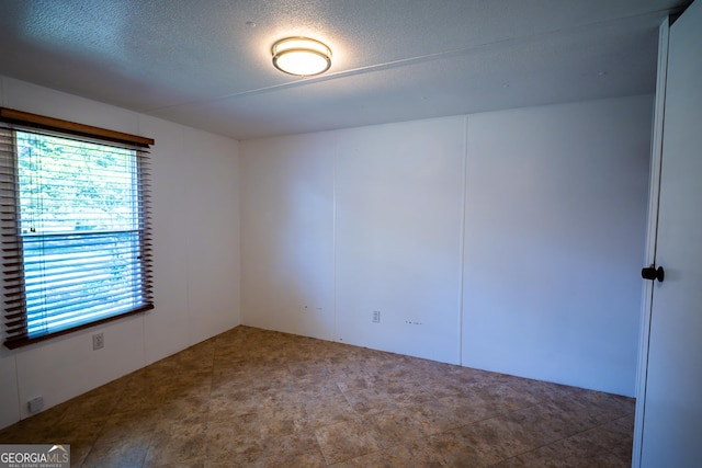 67 Dixie Park Rd NW, Rome, GA 30165 - spare room featuring a textured ceiling