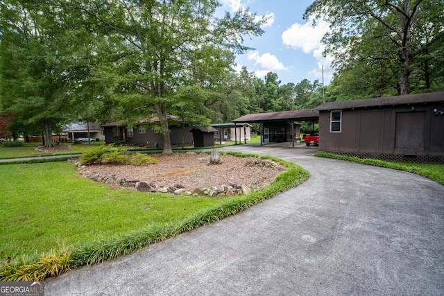 67 Dixie Park Rd NW, Rome, GA 30165 - view of grassy yard featuring driveway
