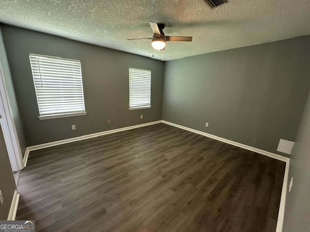 160 Lake Wellington Dr, Kingsland, GA 31548 - unfurnished room with a textured ceiling, dark wood finished floors, and ceiling fan