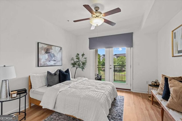 390 17th St NW Unit 4031, Atlanta, GA 30363 - bedroom featuring french doors, access to outside, light wood-style floors, and a ceiling fan