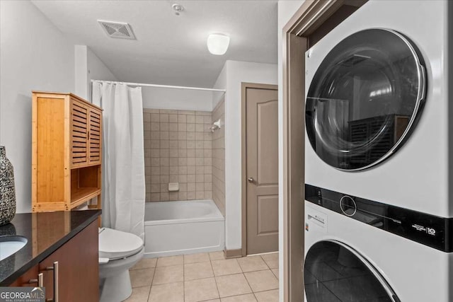 390 17th St NW Unit 4031, Atlanta, GA 30363 - bathroom with stacked washer / drying machine, tile patterned flooring, shower / tub combo, and vanity