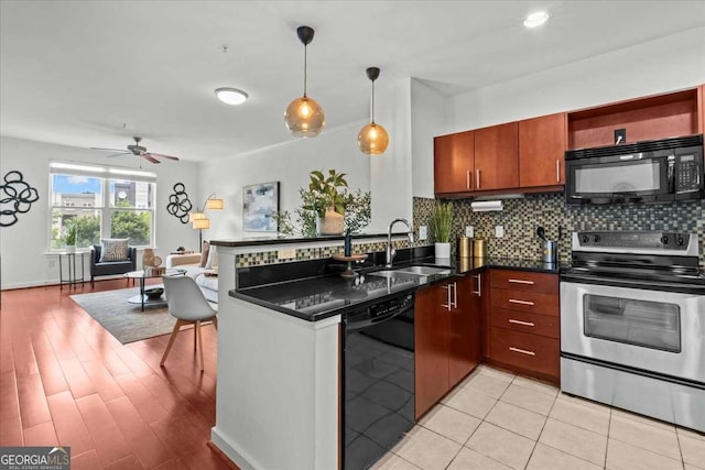 390 17th St NW Unit 4031, Atlanta, GA 30363 - kitchen featuring black appliances, ceiling fan, tasteful backsplash, a peninsula, and open floor plan