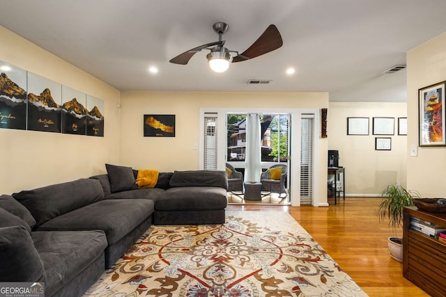 1445 Monroe Dr Unit 14B, Atlanta, GA 30324 - living room featuring ceiling fan, wood finished floors, and recessed lighting