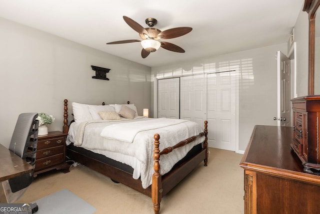 1445 Monroe Dr Unit 14B, Atlanta, GA 30324 - bedroom featuring light colored carpet, a closet, and a ceiling fan