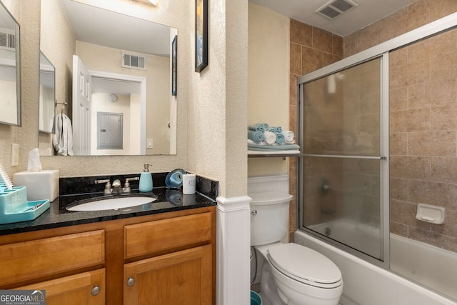 1445 Monroe Dr Unit 14B, Atlanta, GA 30324 - bathroom featuring vanity, a textured wall, and shower / bath combination with glass door
