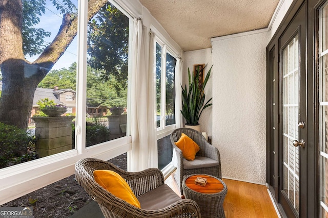 1445 Monroe Dr Unit 14B, Atlanta, GA 30324 - sunroom / solarium with a textured wall, wood finished floors, and a textured ceiling