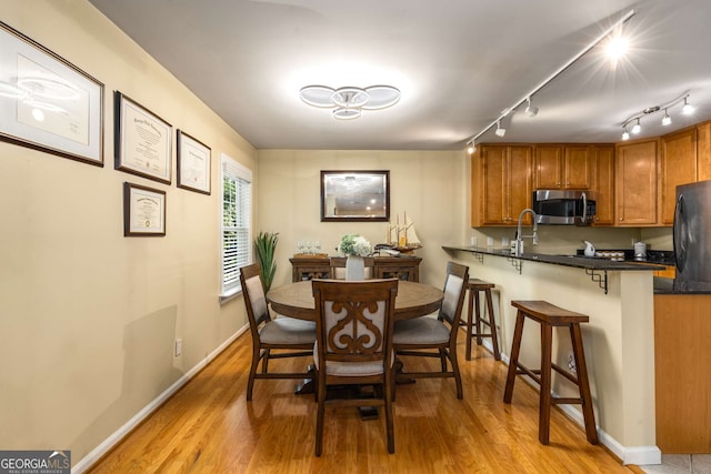 1445 Monroe Dr Unit 14B, Atlanta, GA 30324 - dining space with light wood-style flooring and baseboards